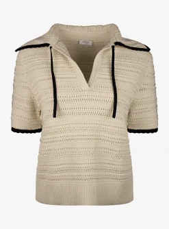 Pull polo beige met zwarte details | DELSCHER. Fashion