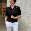 Pull polo zwart wit | DELSCHER. Fashion