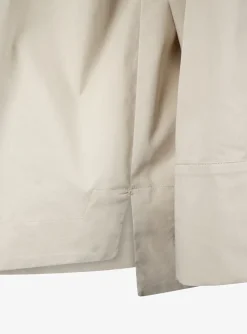 Top clair beige met broche | DELSCHER. Fashion